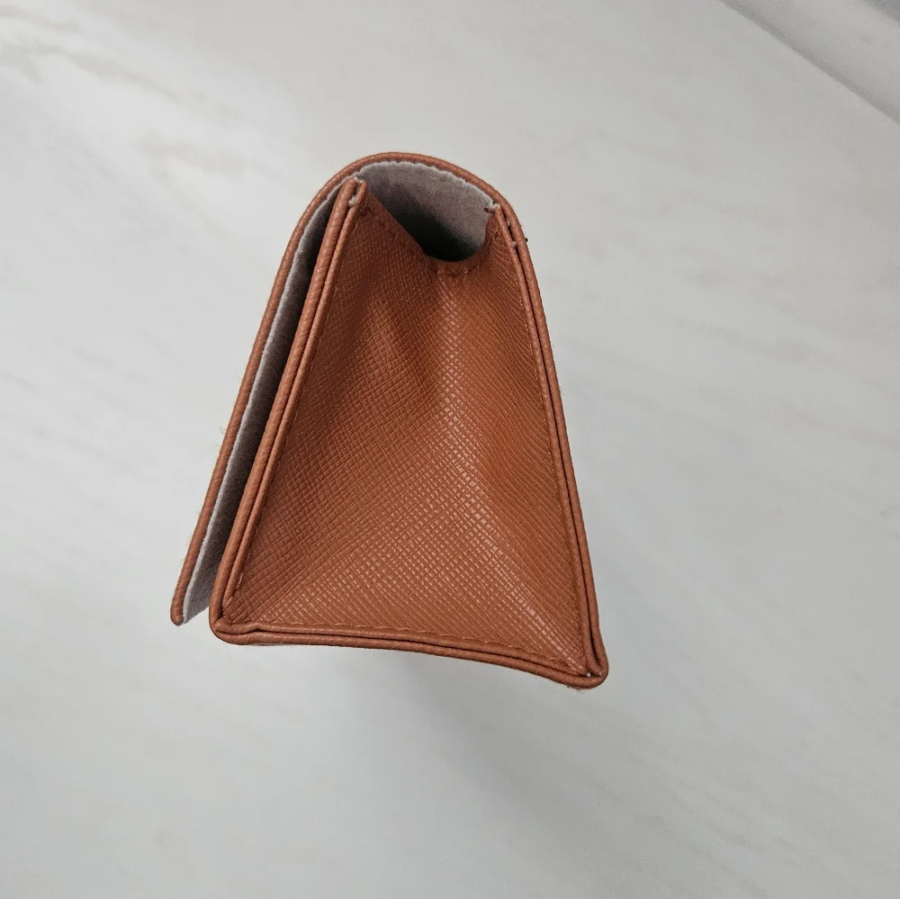 Tory Birch rust colored sunglasses case with‎ glasses cloth